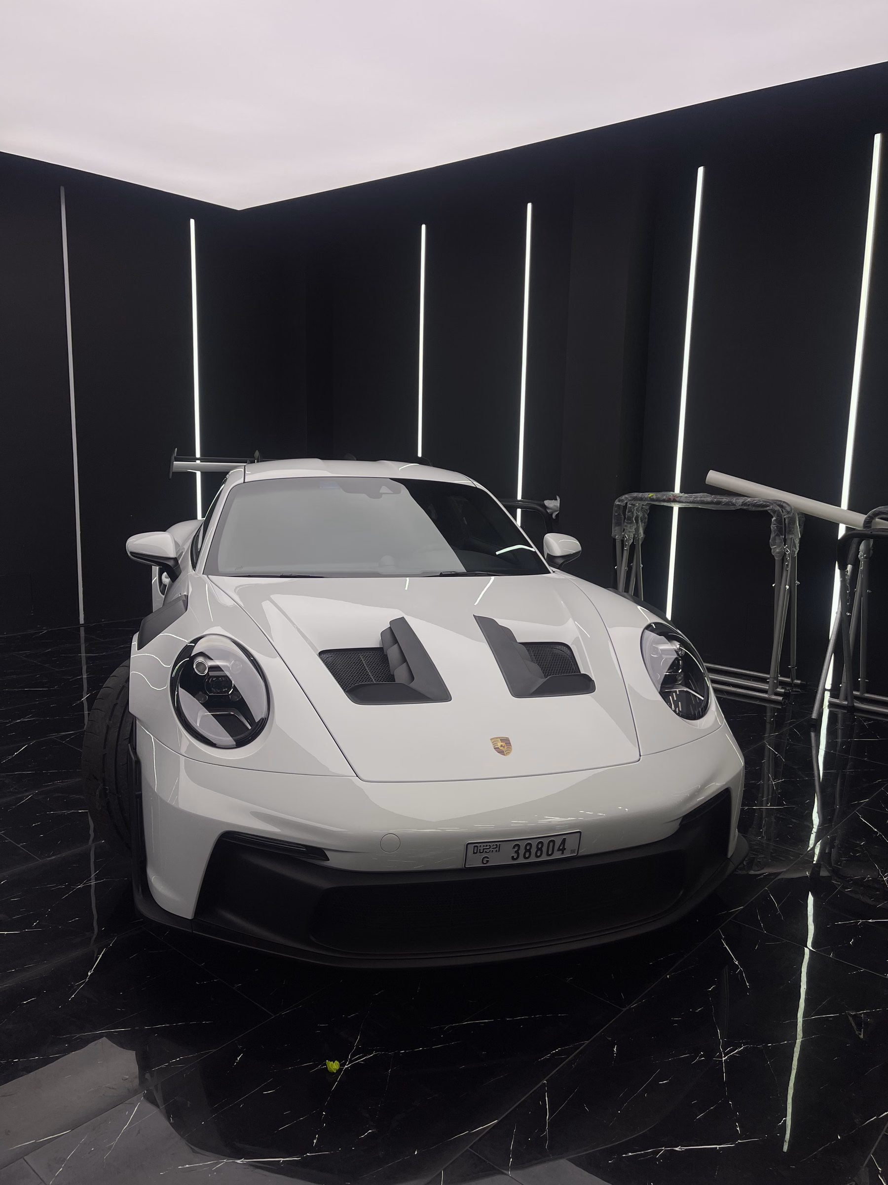 A white Porsche 911 GT3 RS photographed from the front after paint correction and full body paint protection film
